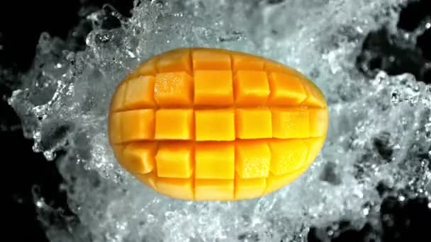 Super Slow Motion Shot Peeled Mango Water Splash Isolated Black — стоковое видео