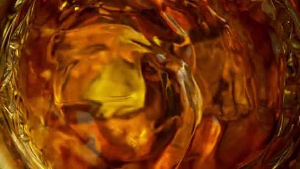 Super Slow Motion Detail Shot Golden Alcohol Liquid Ice Cubes — Stock video