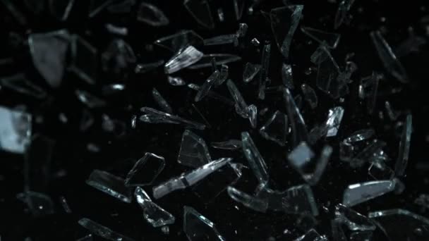 Super Slow Motion Shot Glass Shards Flying Camera Isolated Black — стоковое видео