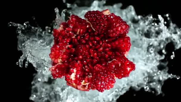 Super Slow Motion Shot Fresh Pomegranate Water Splash Isolated Black — Wideo stockowe