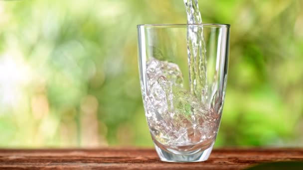Super Slow Motion Shot Pouring Pure Water Glass Green Natural — Video