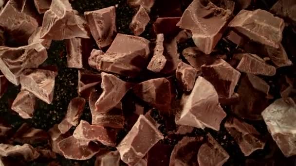 Super Slow Motion Shot Rotating Raw Chocolate Chunks Being Exploded — Video