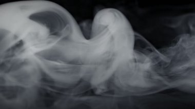 Super Slow Motion Shot of Abstract Flowing Smoke Isolated on Black at 1000fps. Filmed on high speed cinema camera in 4k..