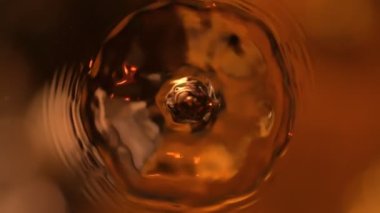 Super Slow Motion Shot of Droplet Falling into Coffee at 1000fps. Filmed with High Speed Cinema Camera, 4k.