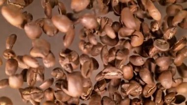 Super Slow Motion Shot of Coffee Beans Explosion Towards Camera with Camera Rotation at 1000fps. Filmed with High Speed Cinema Camera in 4k.