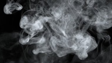 Super Slow Motion Shot of Abstract Flowing Smoke Isolated on Black at 1000fps. Filmed on high speed cinema camera in 4k..