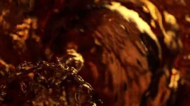 Super Slow Motion Abstract Shot of Bubbling Coffee Brown Liquid at 1000fps. Filmed on high speed cinema camera in 4k..