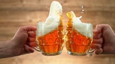 Super Slow Motion Shot of Beer Glasses Cheering at 1000fps. Filmed with High Speed Cinema Camera, 4K.