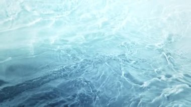 Super Slow Motion Abstract Shot of Waving Blue Clear Water Surface at 1000fps. Filmed on high speed cinema camera in 4k..
