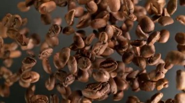 Super Slow Motion Shot of Coffee Beans Explosion Towards Camera with Camera Rotation at 1000fps. Filmed with High Speed Cinema Camera in 4k.