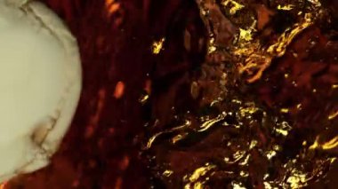 Super Slow Motion Abstract Shot of Pouring Cream into Coffee at 1000fps. Filmed on high speed cinema camera in 4k..