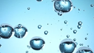 Super Slow Motion Macro Shot of Rising Various Bubbles in Water at 1000 fps. Filmed with High Speed Cinema Camera in 4K resolution.