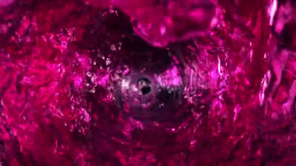 Super Slow Motion Shot Pink Liquid Whirling Spelling Glass Bule — стоковое видео