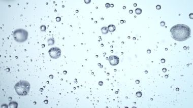 Super Slow Motion Macro Shot of Rising Various Bubbles in Water at 1000 fps. Filmed with High Speed Cinema Camera in 4K resolution.