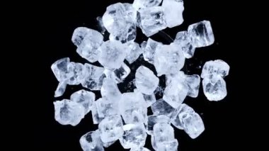 Super slow motion shot of rotating exploded Ice Cubes and on black at 1000fps. Filmed on high speed cinema camera.