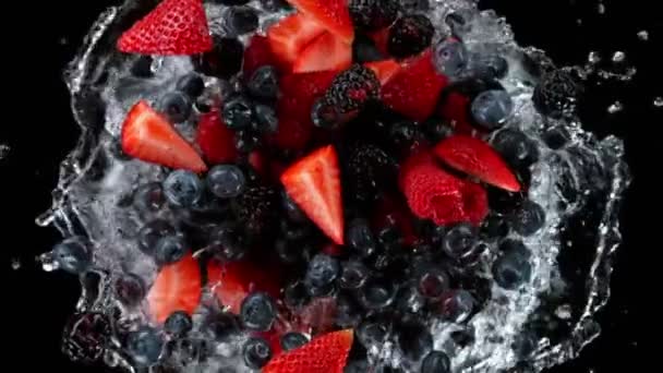 Super Slow Motion Shot Rotating Exploded Berries Fruit Splashing Water — Stock Video