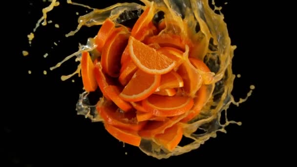 Super Slow Motion Shot Rotating Exploded Orange Slices Splashing Juice — Stockvideo