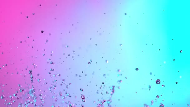 Super Slow Motion Shot Flying Neon Water Drops 1000 Кадров — стоковое видео