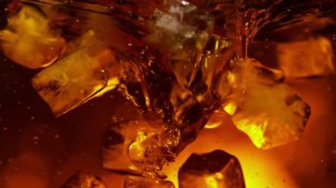 Super Slow Motion Shot of Whirling Fresh Cola and Ice Cubes at 1000fps. Filmed with High Speed Cinema Camera in 4K resolution.