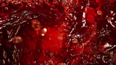 Super Slow Motion Shot of Pouring Red Wine into Whirl at 1000 fps. Shooted with High Speed Cinema Camera in 4K.