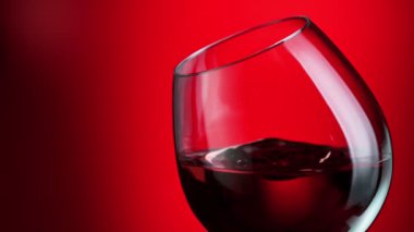 Super Slow Motion Abstract Shot of Rippling Red Wine in Glass at 1000fps. Filmed on High Speed Cinema Camera in 4K.