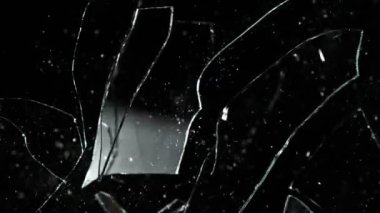 Super Slow Motion Shot of Real Glass Break at 1000 fps Isolated on Black Background.