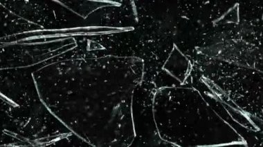 Super Slow Motion Shot of Real Glass Break at 1000 fps Isolated on Black Background.