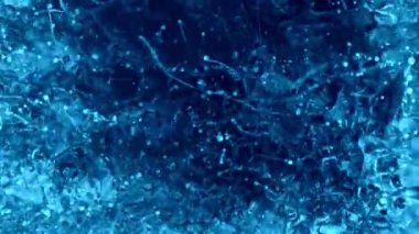 Super Slow Motion Shot of Blue Abstract Splashing Color Background at 1000 fps, Top Shot. Filmed with High Speed Cinema Camera in 4K Resolution.