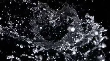 Super Slow Motion Shot of Abstract Water Splash Isolated on Black Background at 1000fps. Filmed with High Speed Cinema Camera at 4K Resolution.
