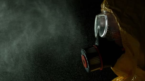Super Slow Motion Shot Man Hazmat Suit Blowing Aerosol Частоті — стокове відео