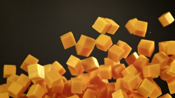 Super Slow Motion Shot Flying Cheese Cubes Black Background 1000 — Vídeos de Stock
