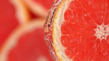 Super Slow Motion Shot of Splashing Water from Rotating Grapefruit Slice at 1000fps. Shooted with High Speed Cinema Camera at 4K.