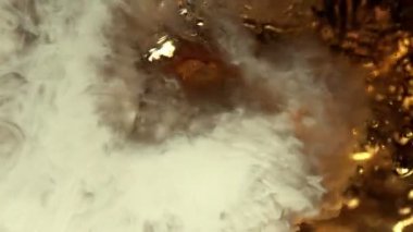 Super Slow Motion Abstract Shot of Pouring Cream into Coffee at 1000fps. Filmed on high speed cinema camera in 4k..