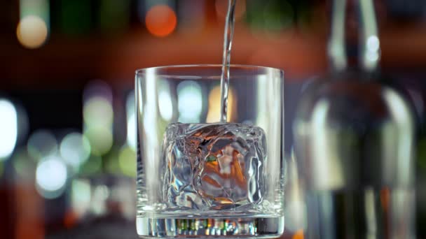 Super Slow Motion Shot Pouring Alcohol Liquid Glass Ice Bar — стоковое видео