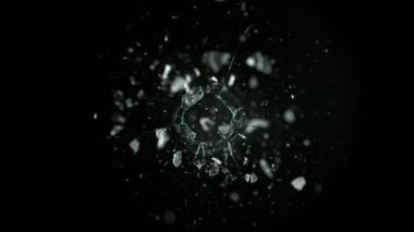 Super Slow Motion Shot of Real Bullet Hole Glass Break Isolated on Black Background at 1000fps. Filmed with high speed cinema camera, 4k.