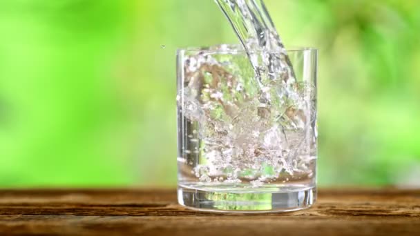 Super Slow Motion Shot Pouring Pure Water Glass Green Natural — Video Stock