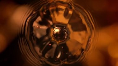 Super Slow Motion Shot of Droplet Falling into Coffee at 1000fps. Filmed with High Speed Cinema Camera, 4k.