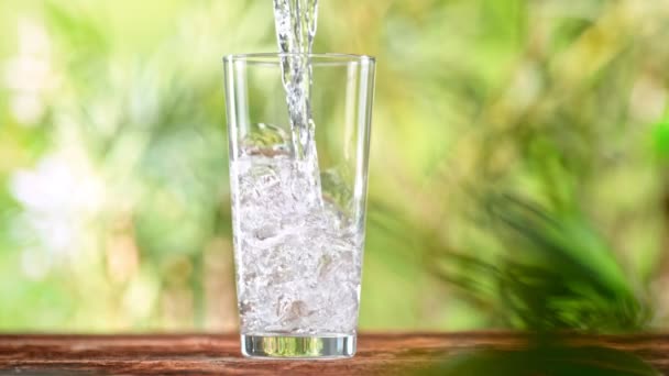 Super Slow Motion Shot Pouring Pure Water Glass Green Natural — Stockvideo