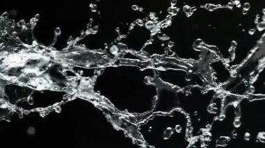 Super Slow Motion Shot of Spiral Water Splash Isolated on Black Background at 1000fps. Filmed with High Speed Cinema Camera at 4K.