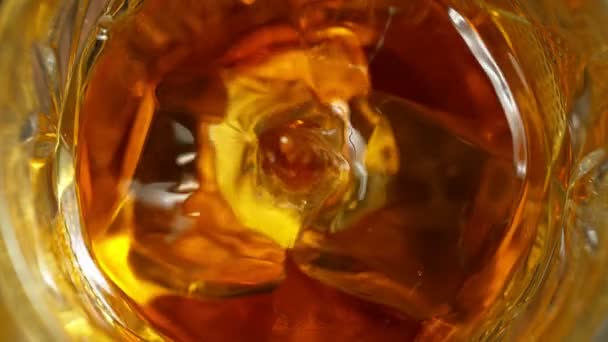 Super Slow Motion Detail Shot Drop Falling Glass Whiskey Ice — Stock Video