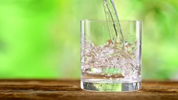 Super Slow Motion Shot Pouring Pure Water Glass Green Natural — Video Stock