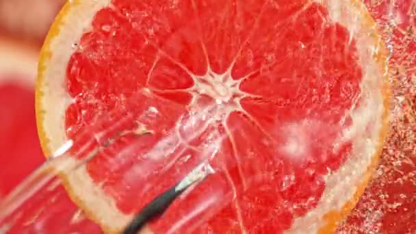 Super Slow Motion Shot Spring Water Rotating Grapefruit Slice 1000Fps — стоковое видео