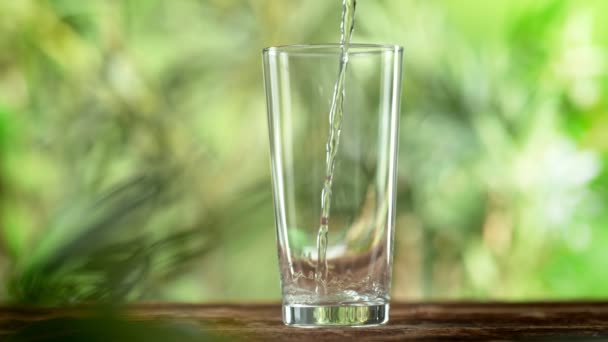 Super Slow Motion Shot Pouring Pure Water Glass Green Natural — Wideo stockowe