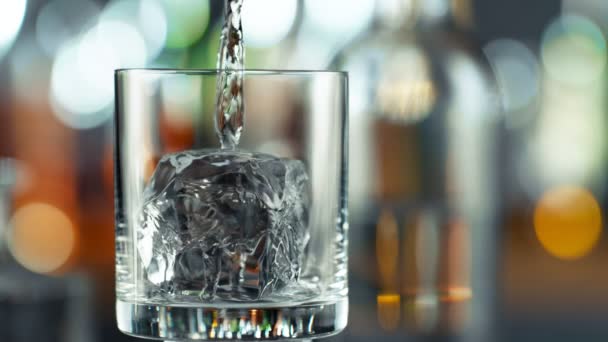 Super Slow Motion Detail Shot Pouring Transparent Alcohol Liquid Glass — Vídeos de Stock