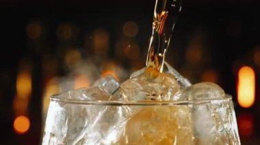 Super Slow Motion Shot of Pouring Fresh Cola Lemonade on Ice Cubes With Camera Motion at 1000fps. Filmed with High Speed Cinema Camera, 4k.