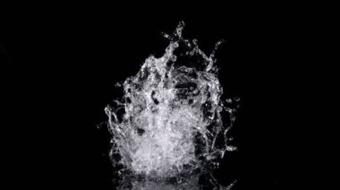 Super Slow Motion Shot of Real Water Splash Explosion from Isolated on Black at 1000fps. Filmed on high speed cinema camera in 4k..