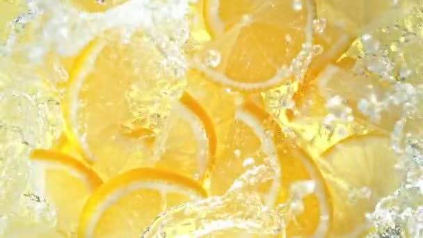Super Slow Motion Shot Fresh Lemon Slices Falling Water Whirl — Stock Video