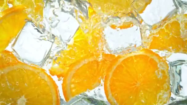 Super Slow Motion Shot Water Wave Splashing Orange Slices Ice — Videoclip de stoc
