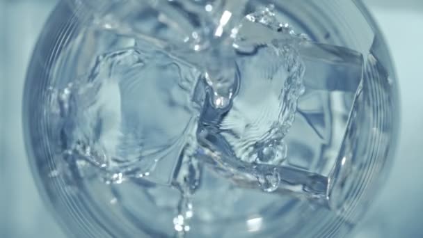 Super Slow Motion Detail Shot Louring Vodka Crystal Clear Cubes — Stock video
