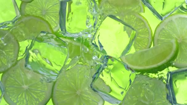 Super Slow Motion Shot Water Wave Splashing Lime Slices Ice — Vídeos de Stock